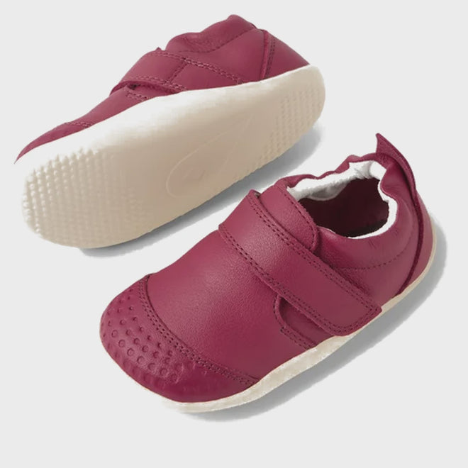 The Bobux XP Xplorer First Walking Shoes Go Beaujolais Purple are soft pre-walker leather shoes with white flexible soles, Velcro straps, and a textured toe, shown against a plain white background., 9420074809070, 9420074809087, 9420074809094, 9420074809155