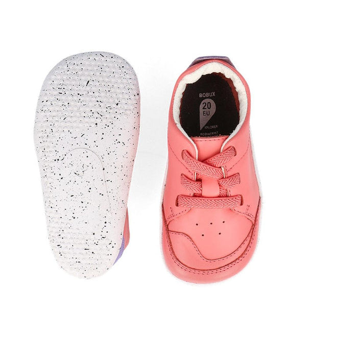 A pair of Bobux XP Explorer Sport First Walker Sneaker Ocean Coral 502204 toddler shoes—one shows pink laces, the other a white, flexible sole with black speckles. The insole reads BOBUX 20 EU. Crafted from premium leather., 9420075785427, 9420075783324, 9420075784512, 9420075783621