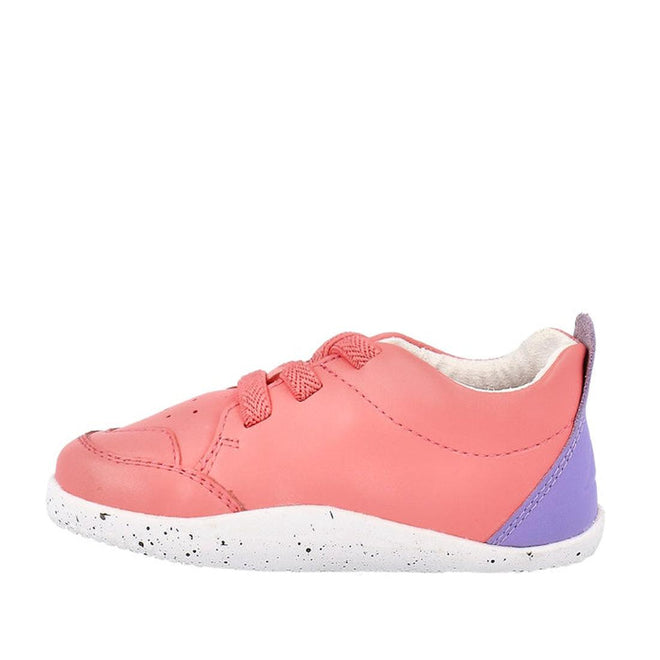 The Bobux XP Explorer Sport First Walker Sneaker Ocean Coral 502204 features pink uppers with matching laces, a flexible white speckled sole, and a purple heel accent, displayed from the side on a plain white background., 9420075785427, 9420075783324, 9420075784512, 9420075783621