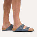 Someone wearing BIRKENSTOCK Arizona Birko Flor Balsat Grey Regular Width 2 Strap Sandals stands on a light-colored surface., 51737, 51738, 51739, 4067707675807, 4067707675845, 4067707675883, 4067707675920, 4067707675968, 4067707676002, 4067707676040, 51747, 51748, 51749