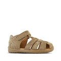 The Clarks Marcus Toddlers Taupe Leather Sandal E features a closed heel, open cage toe, multiple straps, and hook-and-loop closure. The light brown sole completes its stylish look, shown here against a plain white background.