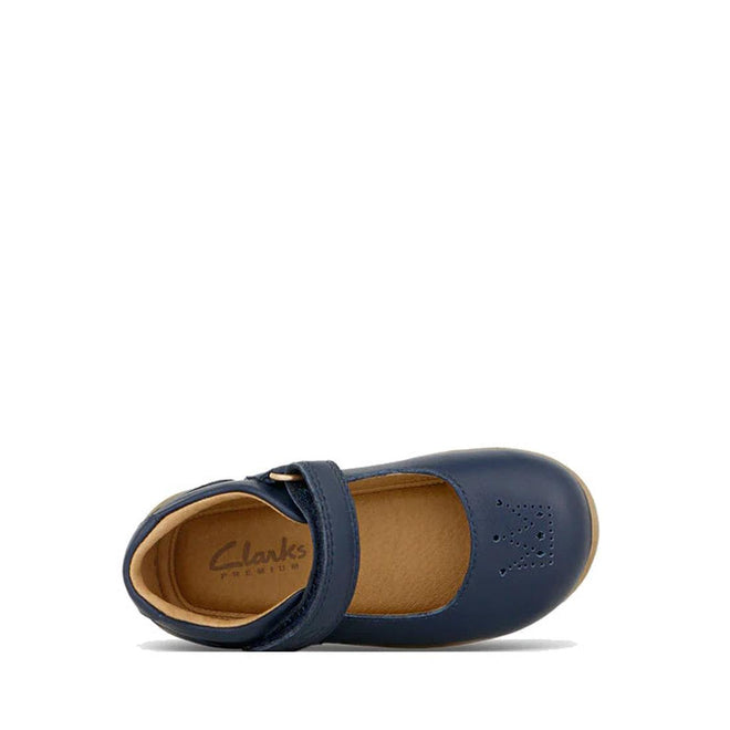 A Clarks Toddlers Maddison Leather Mary Jane Shoe in navy (D narrow width) features a Velcro strap, tan interior, and butterfly-shaped toe perforations, shown from above on a white background., 9336078974280, 9336078974303, 9336078974327, 9336078974341, 9336078974365
