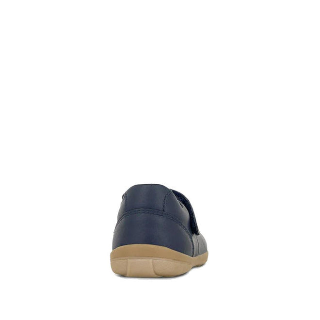 The Clarks Toddlers Maddison Leather Mary Jane Shoe in navy (D narrow width) features a tan rubber sole, inspired by classic Mary Janes, shown from the back against a plain white background., 9336078974280, 9336078974303, 9336078974327, 9336078974341, 9336078974365