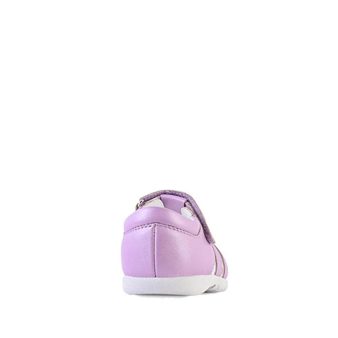 The Clarks Shelly Lilac Toddlers Leather Closed Toe Sandal, featuring a light purple color and white sole, is displayed from the back on a plain white background., 9336078577535, 9336078577573, 9336078577610, 9336078577658, 9336078577696