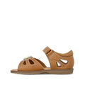 The Clarks Carrie Tan Leather Girls Sandal features cutout details, a closed heel, adjustable ankle strap, white stitching, and a flat rubber sole for all-day comfort and durability., 9336078210852, 9336078210890, 9336078210937, 9336078210975, 9336078211019, 39903, 39905, 39908, 39909, 39911, 39912, 39913
