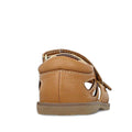 The Clarks Carrie Tan Leather Girls Sandal, shown from the back, features tan stitching, side cut-out details, and a flat rubber sole against a white background., 9336078210852, 9336078210890, 9336078210937, 9336078210975, 9336078211019, 39903, 39905, 39908, 39909, 39911, 39912, 39913