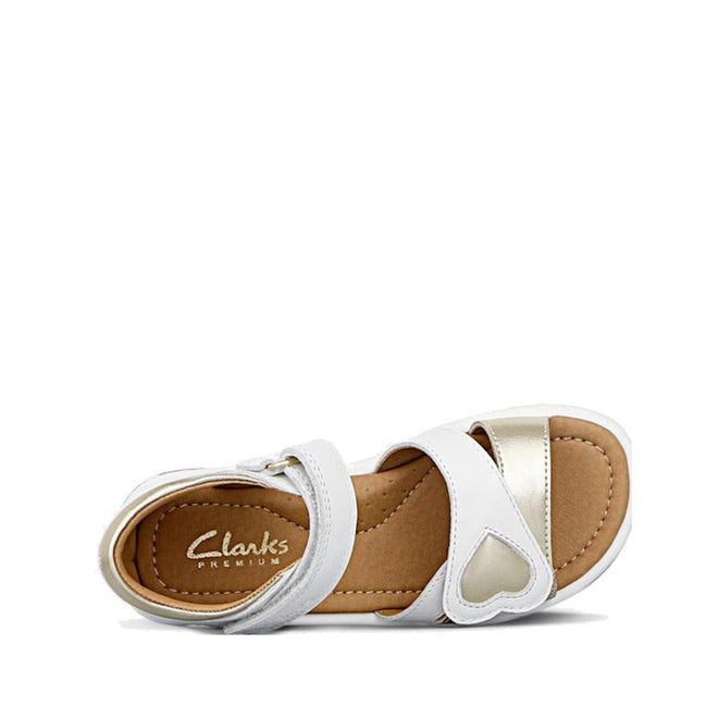 The Clarks Girls Pippa White Leather Sandals (E Width) feature gold accents, Velcro straps, a heart detail, leather upper, and a tan insole with Clarks Premium branding—perfect for adjustable comfort and style for growing feet., 9336078233325, 9336078233349, 9336078233363, 9336078233387, 9336078233400, 9336078233424, 39947, 39948, 9336078233066, 9336078233080, 9336078233103, 9336078233127, 9336078233141, 9336078233165, 39939, 39940