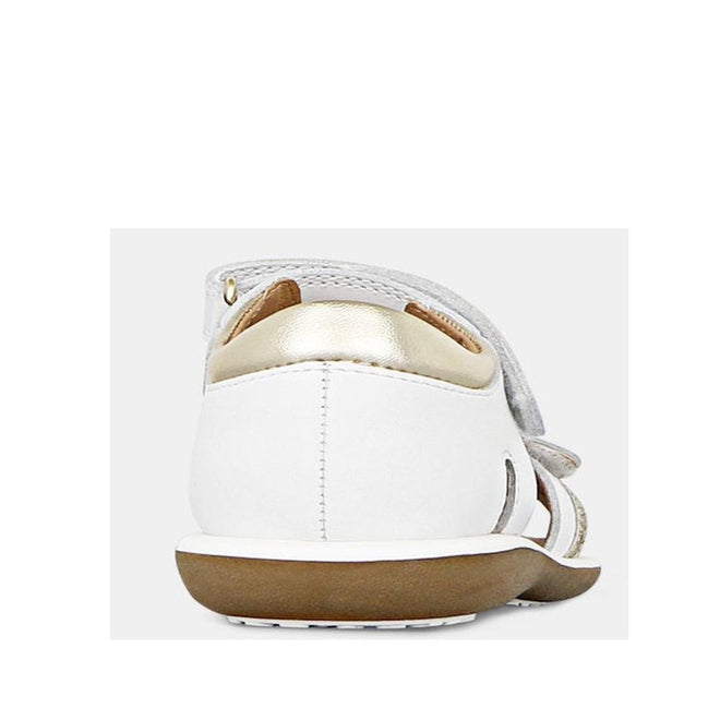 A close-up rear view of Clarks - Girls Pippa White Leather Sandals E, featuring a brown sole, gold accent on the heel, and white leather adjustable upper straps. The background is plain and light-colored., 9336078233325, 9336078233349, 9336078233363, 9336078233387, 9336078233400, 9336078233424, 39947, 39948, 9336078233066, 9336078233080, 9336078233103, 9336078233127, 9336078233141, 9336078233165, 39939, 39940