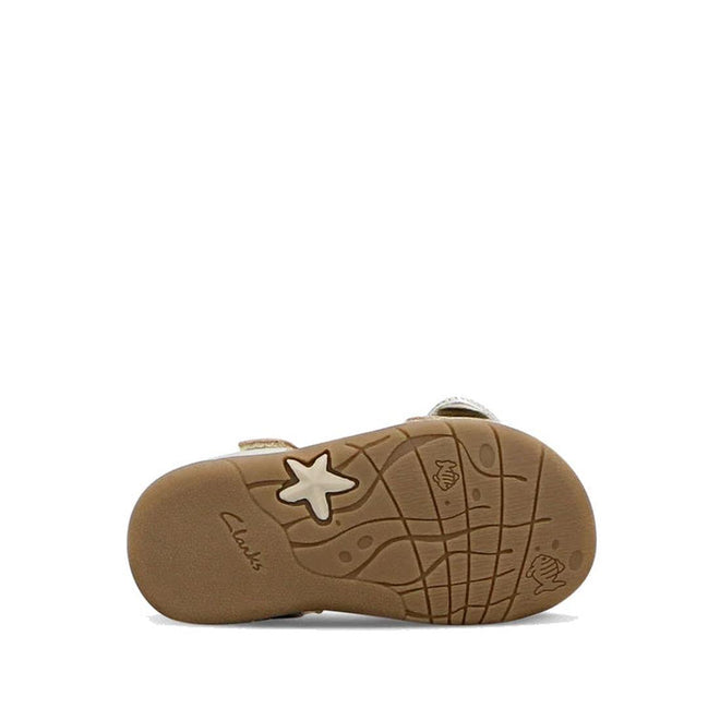 Bottom view of the Clarks Samara Toddlers Gold Leather Sandal (D Narrow Width) shows a textured rubber sole with embossed stars and seashells. "Clarks" is printed near the heel. Perfect for toddlers needing stylish, narrow-fit sandals. White background., 40541, 9336078235183, 9336078235220, 9336078235268, 9336078235305, 40546, 40547, 40548, 40549, 40532, 9336078234926, 9336078234940, 9336078234964, 9336078234988, 9336078235008, 9336078235022, 9336078235046, 9336078235060
