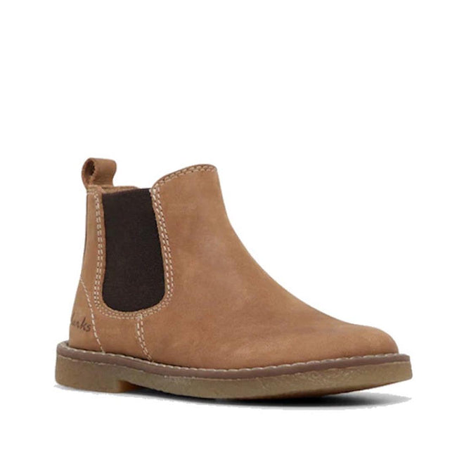 The Clarks Chelsea II Jnr Tan Toddlers Leather Boot features tan leather, a rounded toe, black elastic side panel, pull tab, and flat rubber sole. Photographed against a white background.