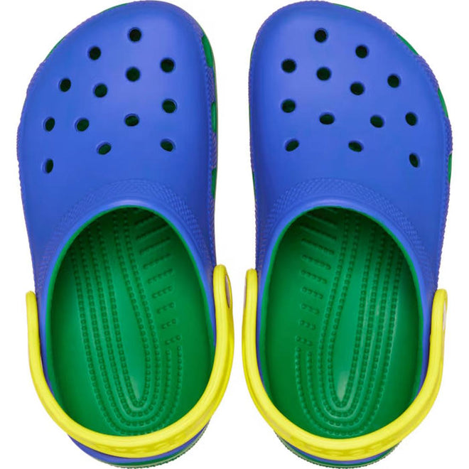 A pair of Crocs Kids - Youths Retro Sport Classic Clog K Blue Bolt Green Yellow Sandals, viewed from above, featuring bold color blocking and top ventilation holes., 198445214431, 198445214448, 198445214455, 198445214462, 198445214479, 198445214486, 198445214509, 198445214493, 48911