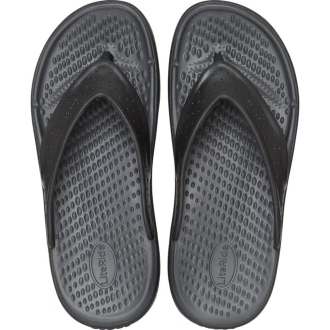 A pair of Crocs - Mens In Motion Flip Flop Jandal in black and grey, viewed from above. They feature textured straps and LiteRide foam footbeds for comfort, labeled LiteRide., 48783, 198445177620, 198445177637, 198445177576, 198445177583, 198445177590, 48789, 48790, 48791, 48792