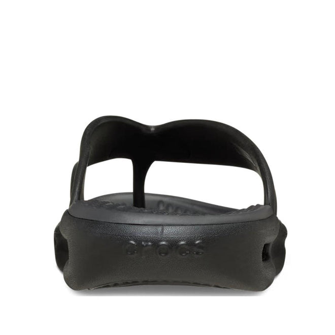 Front view of a single Crocs - Mens In Motion Flip Flop Jandal in black/grey, showing the open toe, contoured LiteRide foam footbed, and embossed Crocs branding on the front sole., 48783, 198445177620, 198445177637, 198445177576, 198445177583, 198445177590, 48789, 48790, 48791, 48792