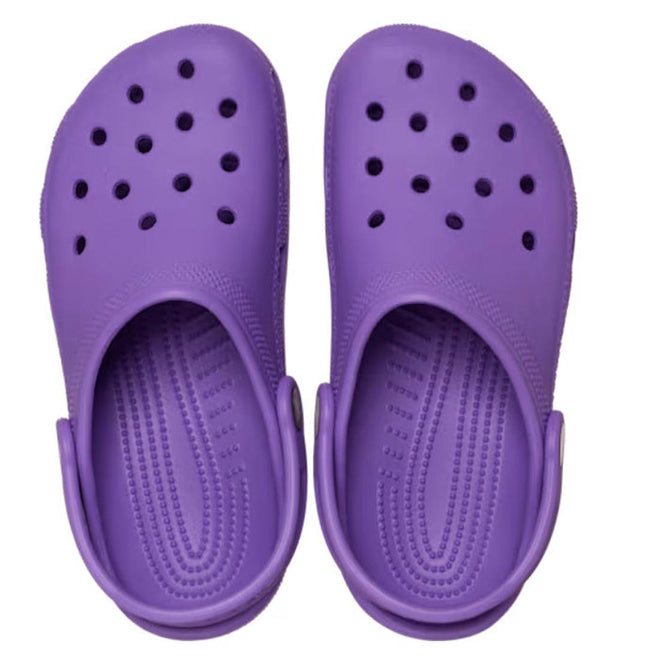 A pair of Crocs Kids Toddlers - Classic Clog Purple in toddler sizes features ventilation holes and adjustable heel straps, shown from above on a white background—ideal water-friendly shoes for little feet., 49897, 49898, 198445337253, 198445337260, 198445337277, 198445337215