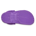 The image displays the sole of the Crocs Kids Toddlers - Classic Clog Purple, showcasing its textured tread and central logo—emphasizing the grip and style of these water-friendly toddler sandals., 49897, 49898, 198445337253, 198445337260, 198445337277, 198445337215