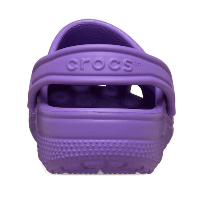 A rear view of the Crocs Kids - Classic Clog Purple - Junior Youths Sizes displays the textured sole, heel strap, and embossed CROCS logo; this water-friendly kids clog is ideal for everyday adventures., 198445337628, 198445337635, 198445337642, 198445337659, 198445337666, 198445337673, 198445337680, 49895, 49896