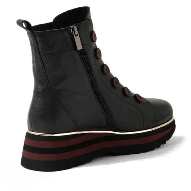 The Django & Juliette Elrick Black Burgundy Leather Boot features a side zipper, decorative buttons, and a bold platform sole with black and red stripes—making it a standout ankle boot for women., 51075, 4434754351792, 4434754351808, 4434754351815, 4434754351822, 4434754351839, 4434754351846