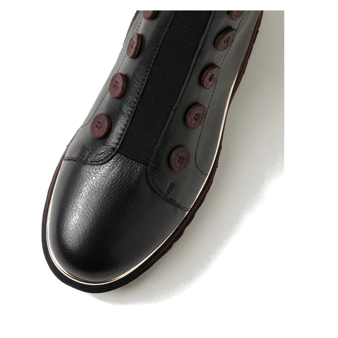 Close-up of the Django & Juliette Elrick Black Burgundy Leather Boot, featuring a rounded toe, decorative buttons along the sides, and a thin white stripe on the sole edge. This stylish women's boot is shown against a white background., 51075, 4434754351792, 4434754351808, 4434754351815, 4434754351822, 4434754351839, 4434754351846