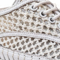Close-up of Django & Juliete Hamburger White Syn Raffia Leather Sneakers featuring a woven, net-like pattern, white laces, and detailed stitching.