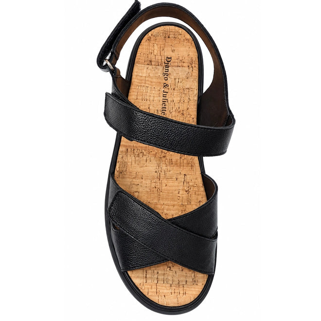 Django & Juliette Inbar Womens Black Sandal w/Back Strap features two wide black straps, a cork footbed, and an adjustable ankle strap with buckle. Shown from above on a white background.