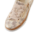 A close-up of the Django & Juliette Torayne Women’s Ombre Beige Sneakers showcases their beige snakeskin-patterned leather, beige laces, gold eyelets, and a gold zipper detail on the side. These stylish sneakers feature a white sole with a brown trim above it, making them perfect for casual wear.