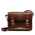 The Dr. Martens Leather Cross Body in Amber Tan features rivets, jeweled details, a shoulder strap, buckle fastening with silver buckles, and the embossed Dr. Martens logo on the front.