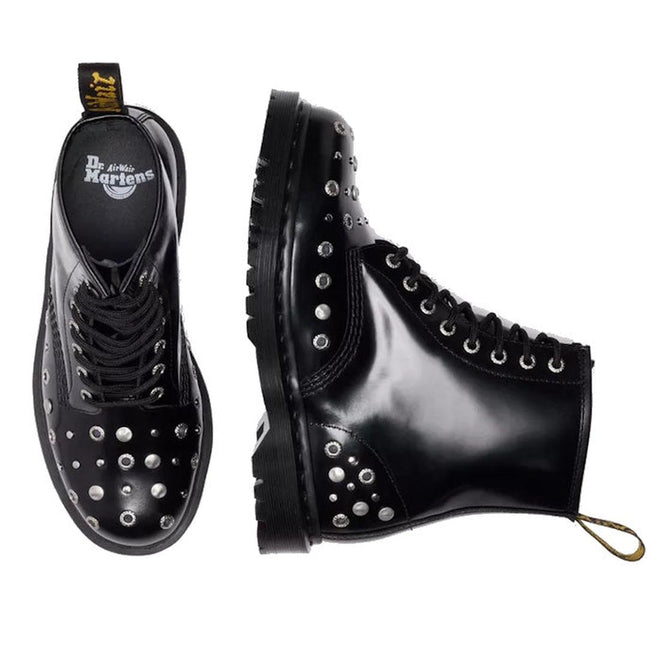 Two Dr Martens 1460 Hardware HDW Buttero Leather Boots in black, each with shiny leather and silver studs on the toe, sides, and heel. One boot is top-viewed; one from the side. Both feature black laces and yellow pull tabs at the back., 49862, 190665797572, 190665797589, 190665797602, 49866, 49867, 49868, 49869