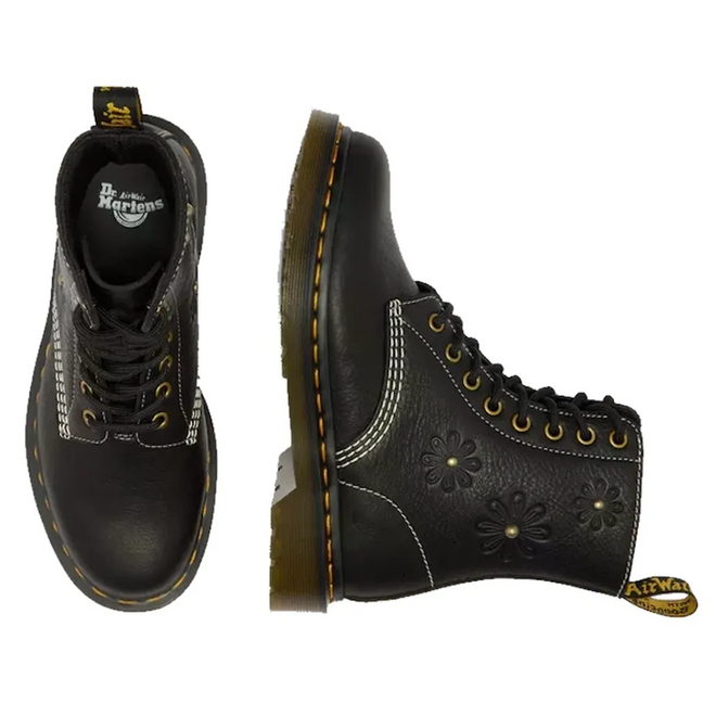 Top and side views of the Dr. Martens Women's 1460 Pascal Flower Black Grizzly Leather Boot, with yellow stitching, black laces, embossed floral patterns on the sides, and a translucent brown sole with a branded pull tab., 52216, 190665781137, 190665781144, 190665781151, 190665781175, 190665781182, 52222