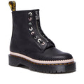 A Dr Martens black leather ankle boot with a front zipper closure and decorative pastel-colored star and crescent-shaped eyelets. The boot features a thick black sole (3.3cm height) with signature yellow stitching and a scalloped pink midsole detail. A yellow-branded pull tab is attached at the back
