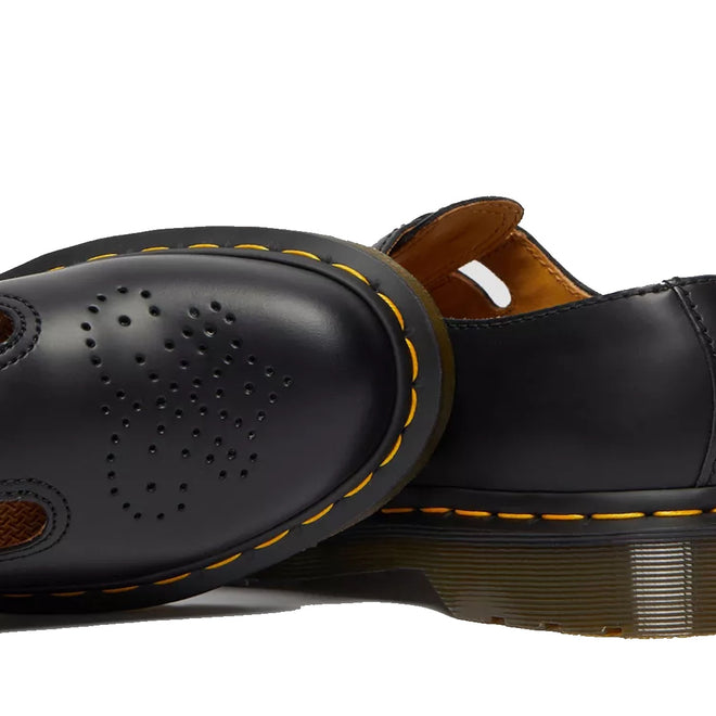 Close-up of Dr Martens 8065 2 Strap Mary Jane Shoe Black Smooth, featuring yellow stitching, perforated details, and smooth leather, highlighting the heel and sole against a white background., 883985051768, 883985051775, 883985051782, 883985051799, 883985051805, 883985051812
