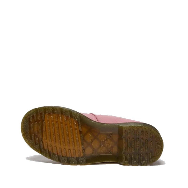A Dr Martens 8065 2 Strap Mary Jane Shoe in Dusky Rose Pink is shown on its side, highlighting its brown translucent textured sole against a white background., 50241, 50242, 50243, 50244, 50245, 50246, 50247, 50241, 190665781861, 190665781878, 190665781892, 50245, 50246, 50247