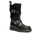The Dr Martens Anistone Bex Strap High Boots feature black leather, a thick sole, silver buckles, ankle strap, biker-inspired details on a mid-calf shaft, and a pull tab for easy pull-on wear.