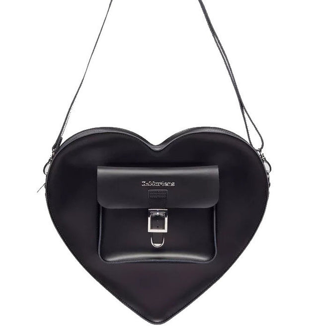 Image of right foot, side on of Dr Martens Large Big Heart Box Backpack Leather Black-Foot Forward Shoes