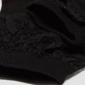 Close-up of Dr Martens Ankle Frill Cotton Blend Socks in black, highlighting their textured lace pattern and ribbed knit fabric, echoing the intricate details and contrasts characteristic of DM's footwear accessories., 190665640809, 190665640793