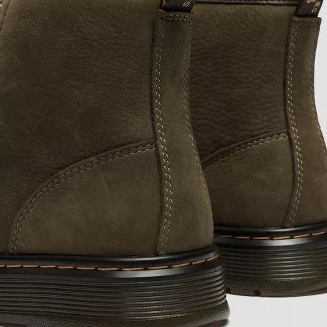 Close-up of the back of two Dr. Martens Brookline Chukka Boots in olive milled nubuck leather, showing visible stitching, black midsoles, heel pull tabs, and a lightweight outsole for comfort., 51342, 190665797053, 190665797060, 190665797084, 190665797091, 190665797107, 190665797121, 51349