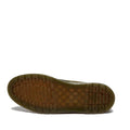 The Dr Martens Brookline Chukka Boot in Olive Milled Nubuck Leather features a brown rubber sole with a lightweight outsole, showcasing a textured grid-like tread and rectangular grooves, photographed on a white background., 51342, 190665797053, 190665797060, 190665797084, 190665797091, 190665797107, 190665797121, 51349