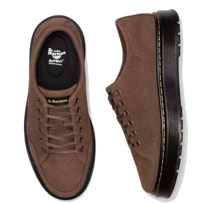 Flay lay of a pair of Brown Dr. Martens Brookline suede shoes on a white background. Showing the top down view of the right foot with it's 6 pair of eyelets and brown laces and 'softwair' fotbed logo on the inner sole. The left foot is on it;s side shoing the yellow stithing around the sole (not visable in the top down view) , flat balck sole and detail on the heel.,
190665752472,
190665752489,
190665752496,