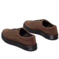 Pair of Dr Martens brookline suede brown shoes with black soles view from the heel looking forward showing the outer foot on the right foot and inner foot on the left foot on a white background.,
190665752472,
190665752489,
190665752496,