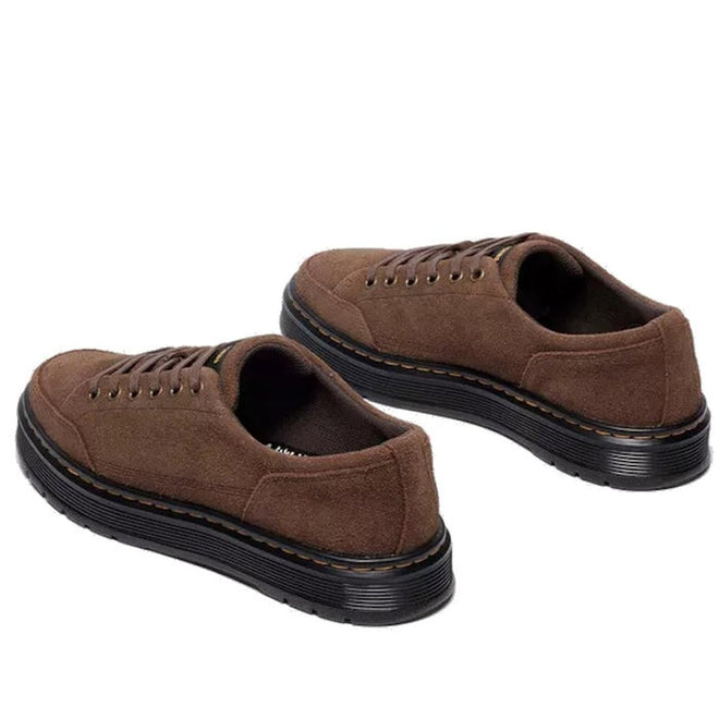 Pair of Dr Martens brookline suede brown shoes with black soles view from the heel looking forward showing the outer foot on the right foot and inner foot on the left foot on a white background.,
190665752472,
190665752489,
190665752496,