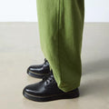 Person wearing green pants and black dr amrtens brookline boots  shoes on a neutral background,
190665752700,
190665752717,
190665752731,
190665752748,
190665752755,
190665752779,