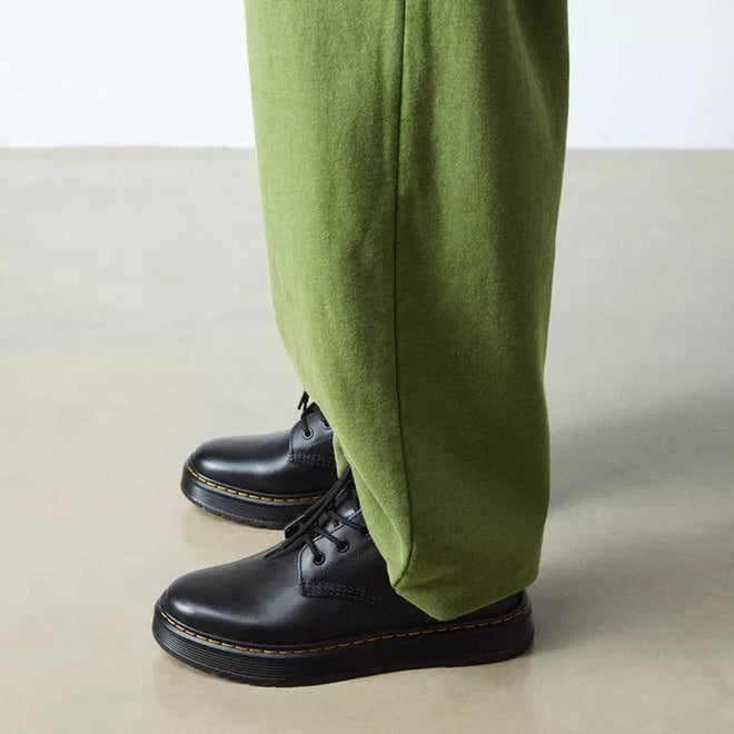 Person wearing green pants and black dr amrtens brookline boots  shoes on a neutral background,
190665752700,
190665752717,
190665752731,
190665752748,
190665752755,
190665752779,