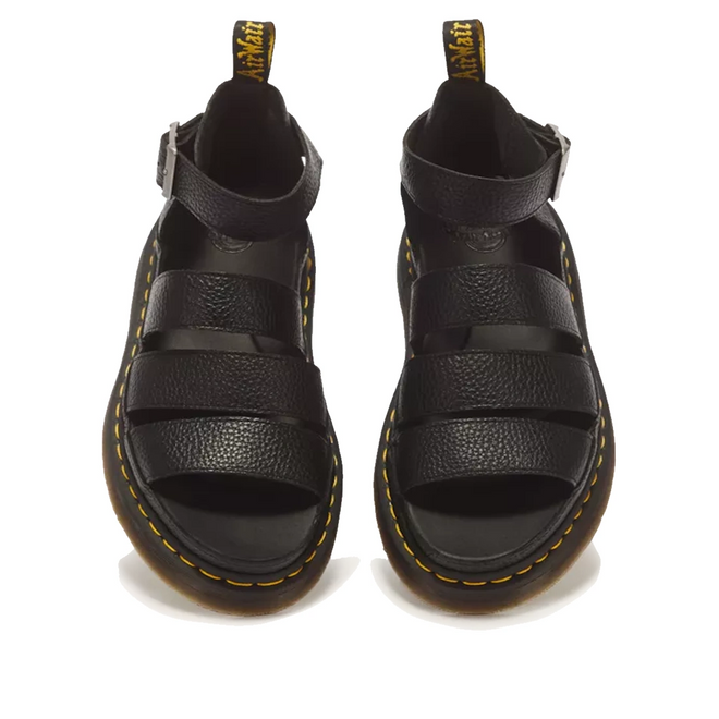 Dr Martens Clarissa II Quad Platform Sandal in black Milled Nappa leather, featuring buckled ankle straps and yellow welt stitching.