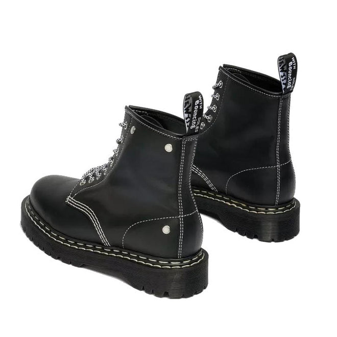 The Dr Martens Bex 1460 WDS White Stitching Black Boot Sendal features smooth black leather, lace-up design, thick ridged Bex soles, white-stitch details, and pull tabs with white text. Displayed at an angle to show back and side views., 50363, 50364, 190665803068, 190665803075, 190665803099, 50369, 50370