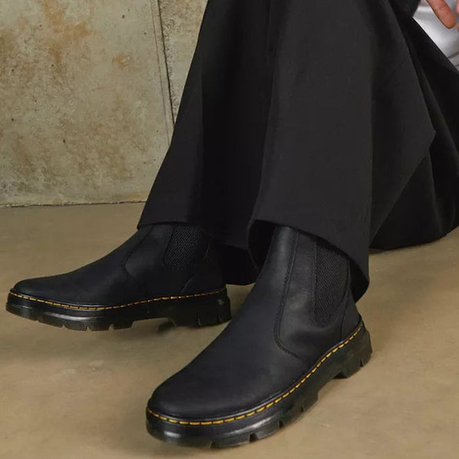 A person sitting on the ground showing the DR Martens Embury pull on chelsea boot in black with sole yellow stitching around the sole which you cannot see top down
190665358766,
190665358773,
190665358780,
190665358803,
190665358810,
190665358827,
190665358841,
190665358858,