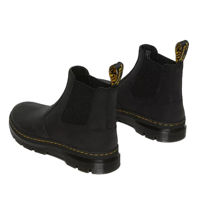 rear view of both feet of Dr Martens Embury in Black pull on chelsea boots showing the pull on tab on the heel and the yellow stitching around the sole. Also in veiw is the elastic gusset on the innner and outer sides of the ankle.,
190665358766,
190665358773,
190665358780,
190665358803,
190665358810,
190665358827,
190665358841,
190665358858,