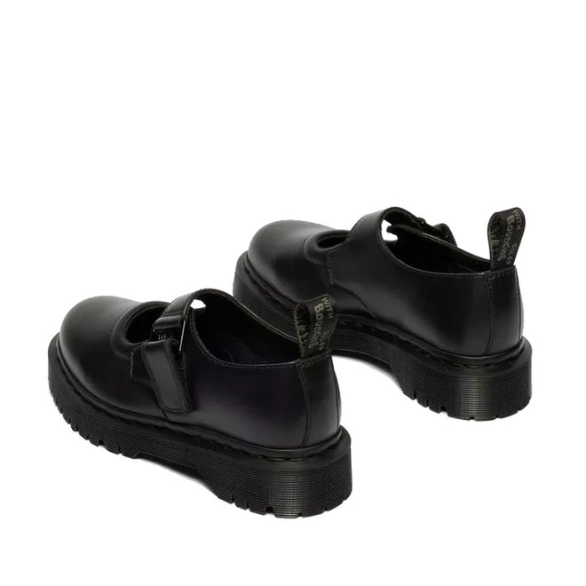 The Dr Martens Bex Indica II Mary Jane Tech Nappa Mono Black features thick, ridged soles, a single front strap with buckle, and branded pull tabs at the heel. Shown from a rear side angle., 190665804744, 190665804751, 190665804768, 190665804782, 190665804799, 190665804805, 50377