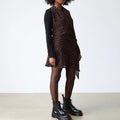 A person stands against a plain background wearing a brown and black animal print dress, black long-sleeve shirt, sheer tights, and Dr Martens - Jadon Polished Smooth Boot 8 up for an edgy look., 883985578883, 883985578890, 883985578906, 883985578913, 883985578920, 883985578937, 883985578944, 883985578951, 883985578975, 883985578968