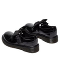A heel, rear shot of a pair of Black Kids Polley Dr Martens  glossy shoes with buckles  that are velcro fstening on a white background.,
190665761818,
190665761832,
190665761856,
190665761863,
190665761764,
190665761788,
190665761801,