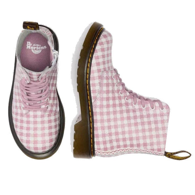 Two Dr Martens kids 1460 J Juniors Gingham Pink Lace Up Boots with zip are shown: one upright displaying the top view in pink gingham, the other on its side highlighting the outer profile and sole., 50424, 50425, 50426, 190665779165, 190665779066, 190665779080, 190665779103