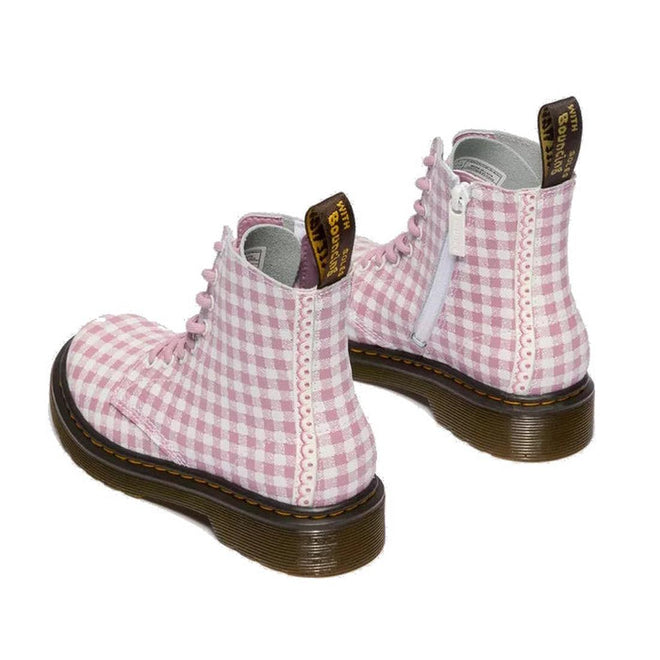 The Dr. Martens kids 1460 J Juniors Gingham Pink Lace Up Boot features white laces, side zippers, thick brown soles, and branded pull tabs on the back of each 8-eye boot., 50424, 50425, 50426, 190665779165, 190665779066, 190665779080, 190665779103